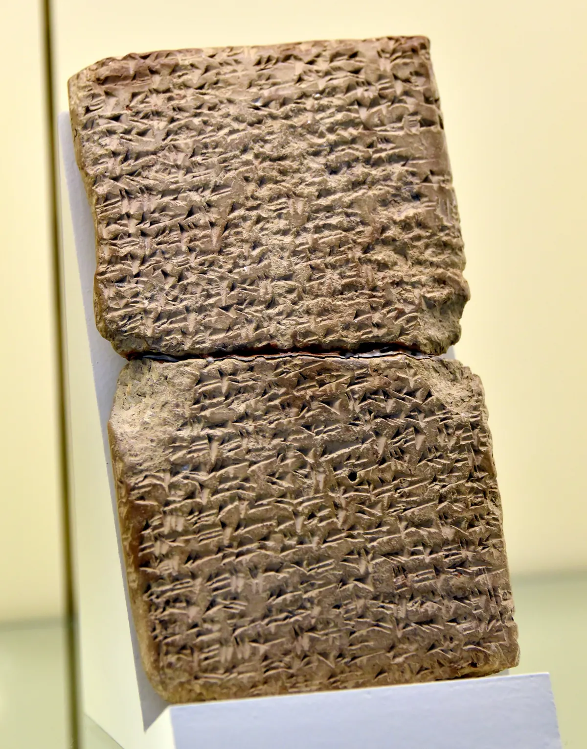 Clay cuneiform tablet in a museum case
