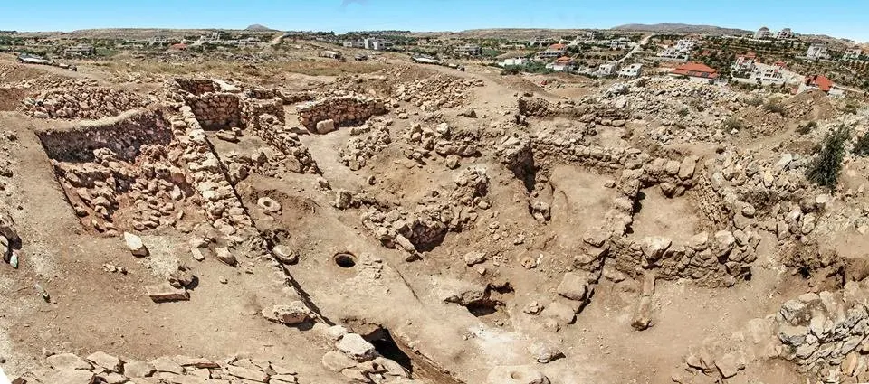 Stone foundations of an ancient gate on a hillside