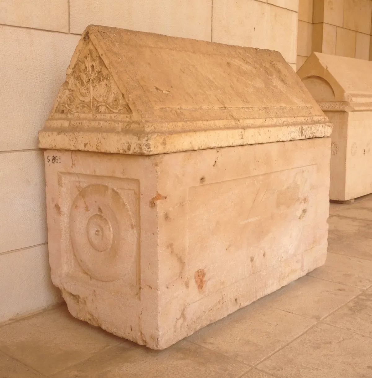 Limestone ossuary lid with scratched Greek letters