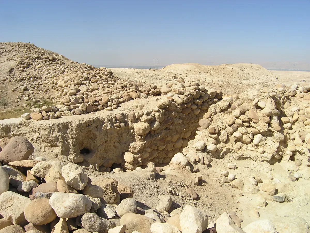 Stone and mudbrick ruins on a dry plain near the Dead Sea