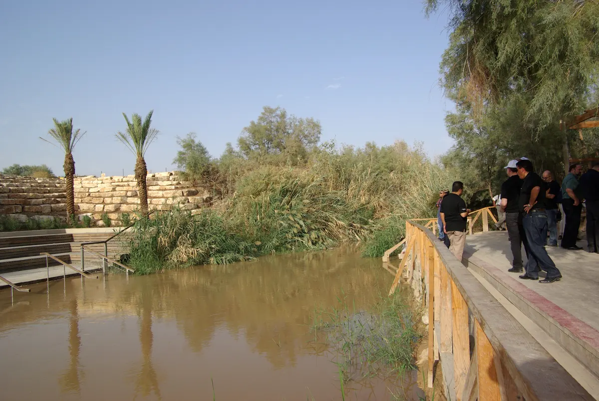 Stone steps and pool ruins among reeds near the Jordan River
