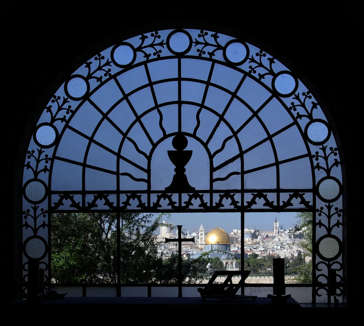 Small tear-shaped church among olive trees overlooking Jerusalem