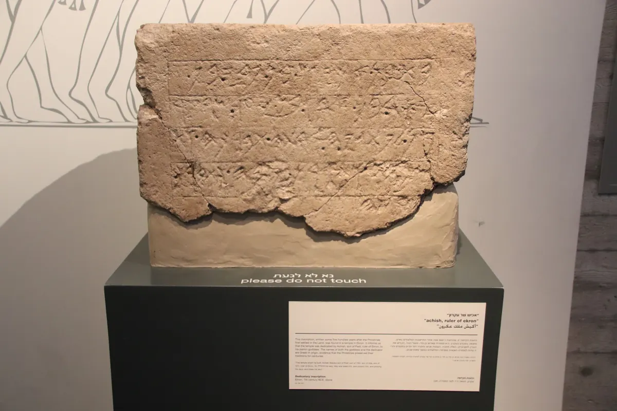 Limestone block with five lines of ancient script