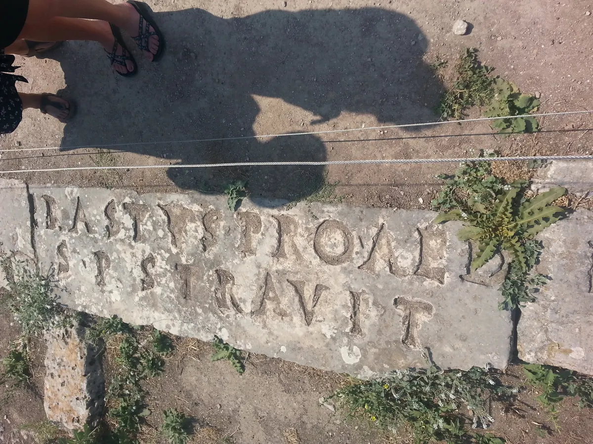 Latin letters cut into limestone paving stones