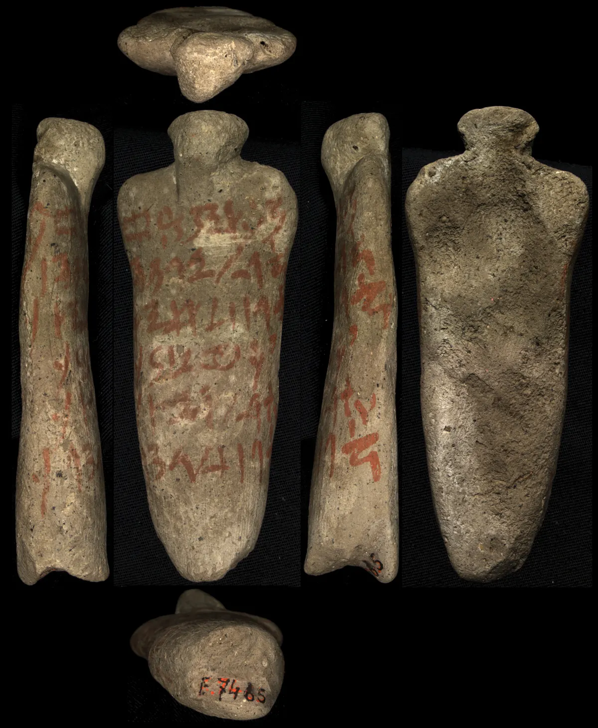 Small clay figurine of a kneeling bound prisoner covered in hieratic writing