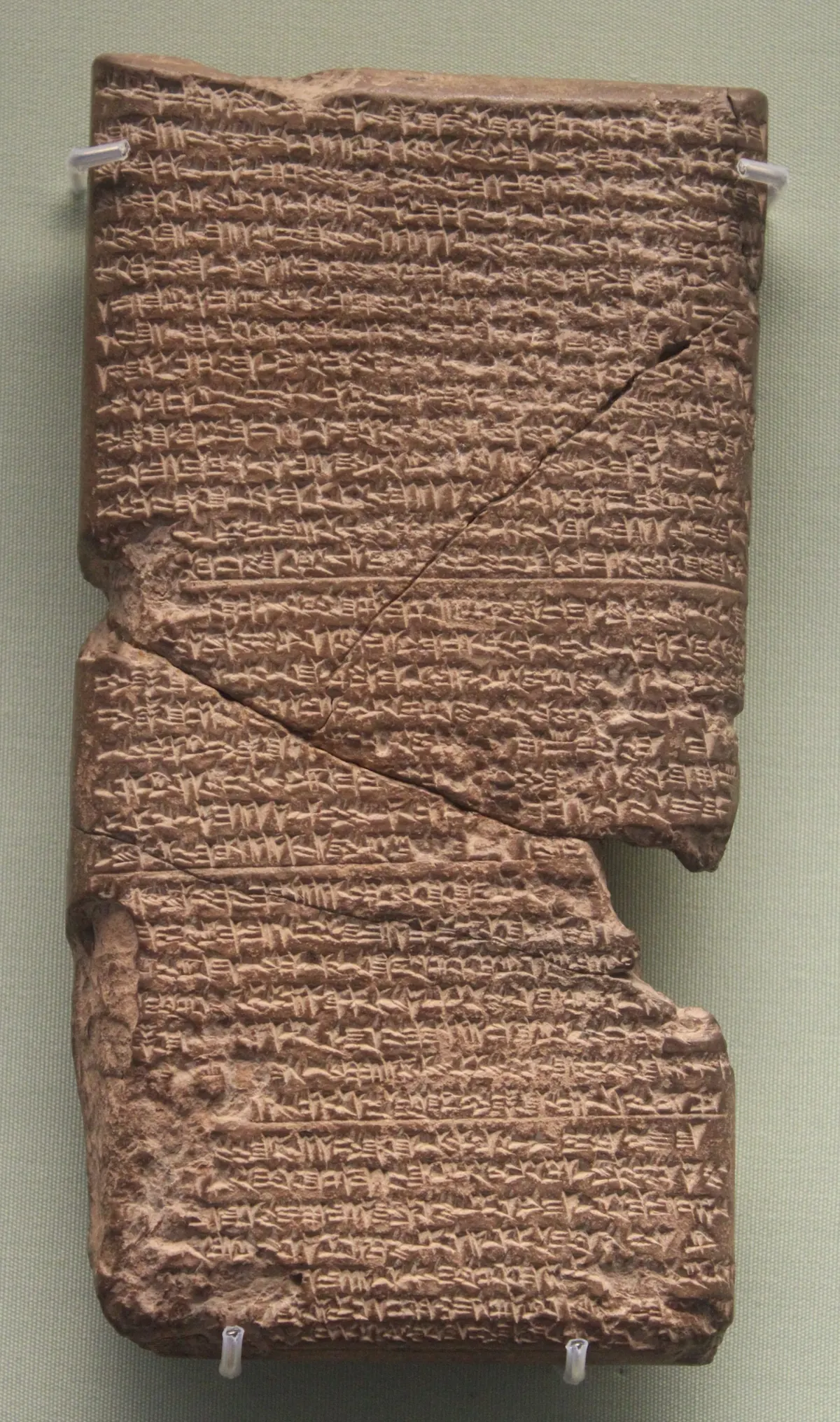 Clay tablet with closely written cuneiform