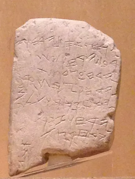 Small limestone tablet with seven lines of early alphabetic script