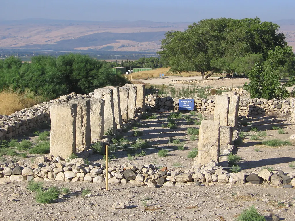 Rows of stone pillars in an excavated building on a mound