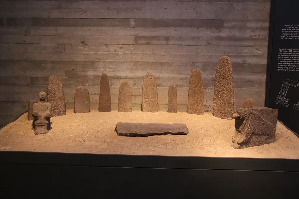 Museum reconstruction of a basalt-lined temple room with offering table