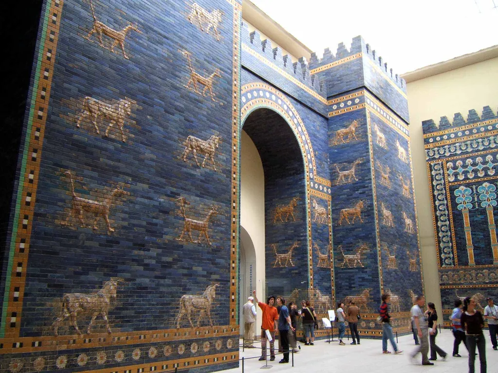 Tall blue glazed-brick gate decorated with golden bulls and dragons