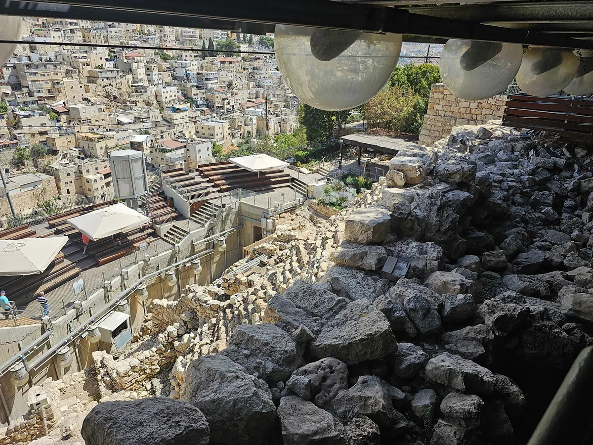 Massive stone wall foundations above a stepped stone slope