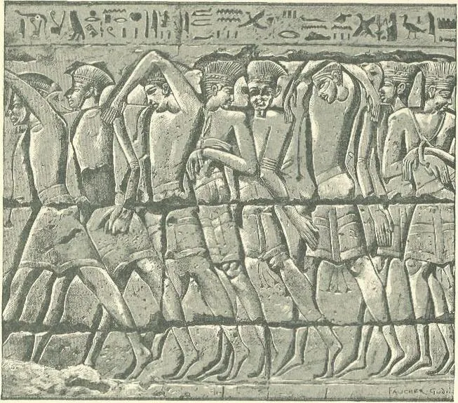 Carved relief of bound prisoners wearing feathered crowns