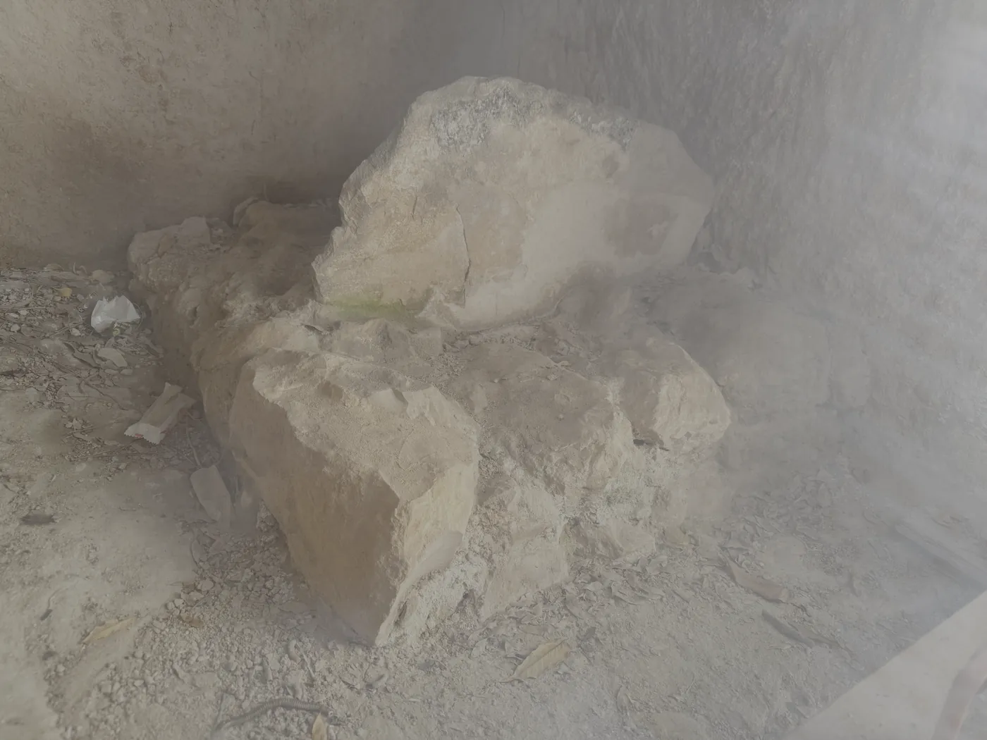 The standing stone (matzevah) set against the wall of its rock-cut room