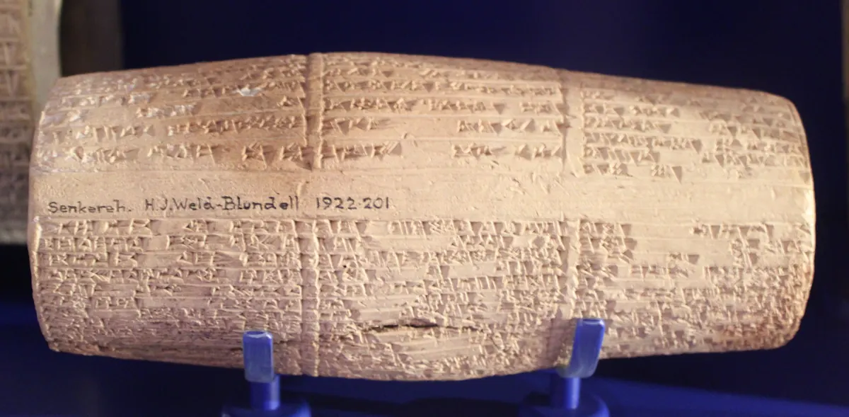 Barrel-shaped clay cylinder inscribed with cuneiform