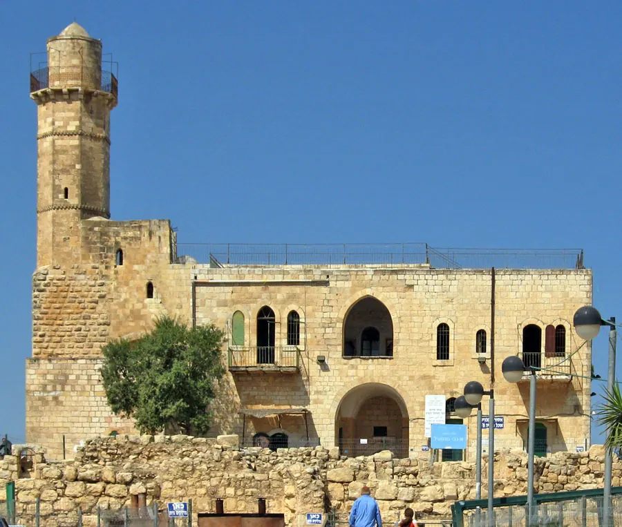 Stone Crusader-era building with minaret on a hilltop