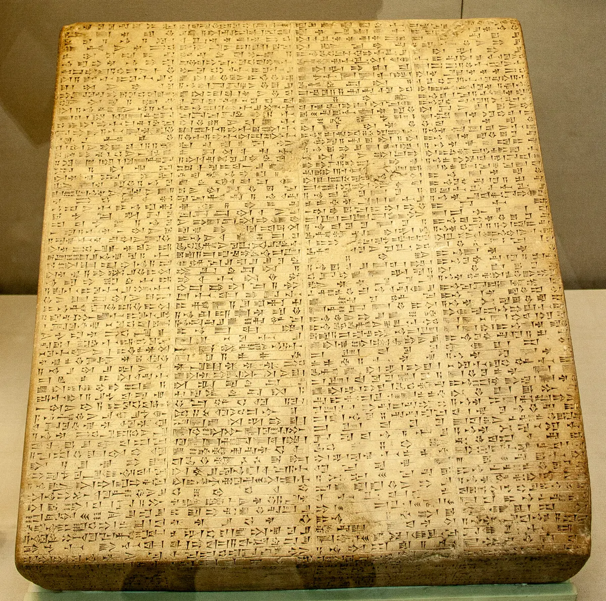Rectangular black stone slab covered in columns of cuneiform