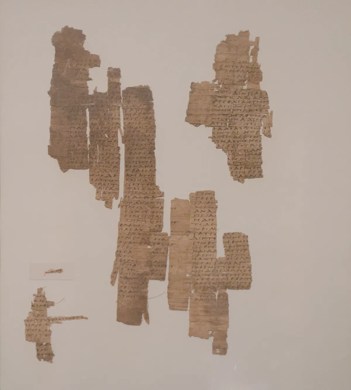 Papyrus page with Greek text, torn at the edges