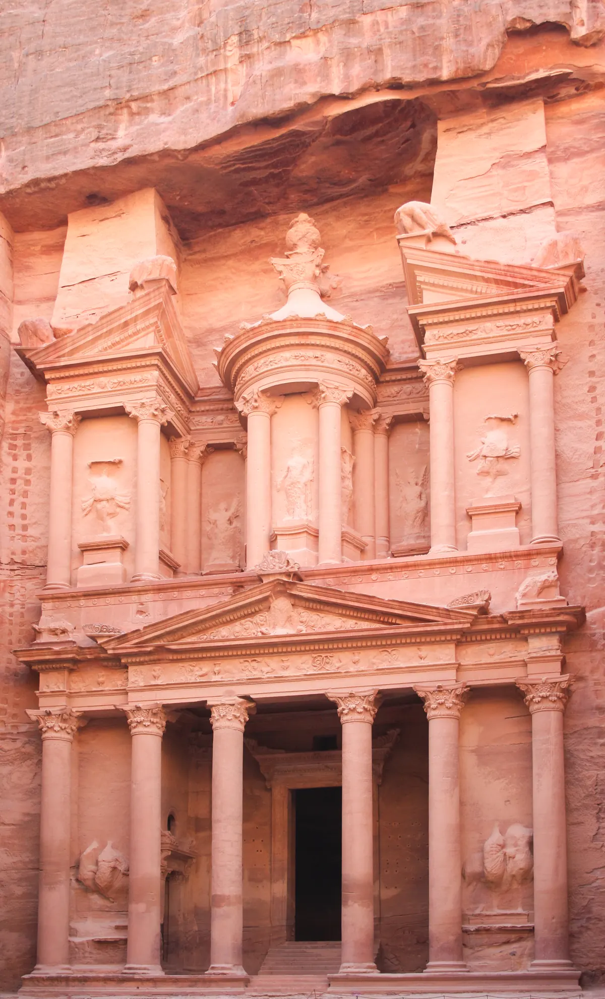 Rock-cut classical facade in a sandstone gorge