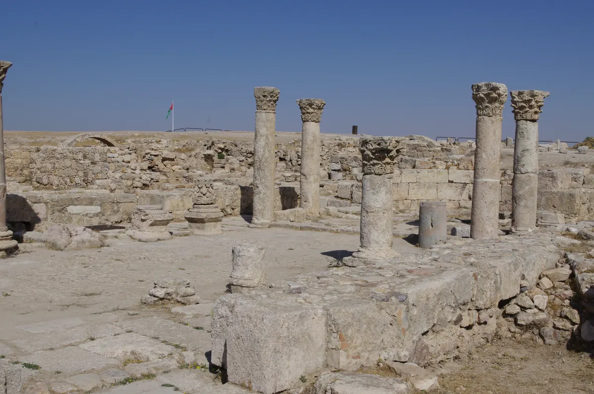 Huge ruined brick piers of a church standing in a modern Turkish town