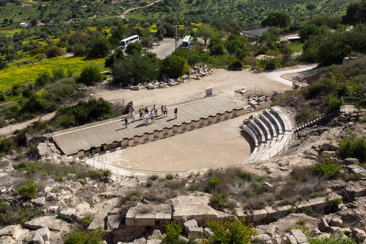 Ancient stone theater carved into a hillside overlooking the Galilee