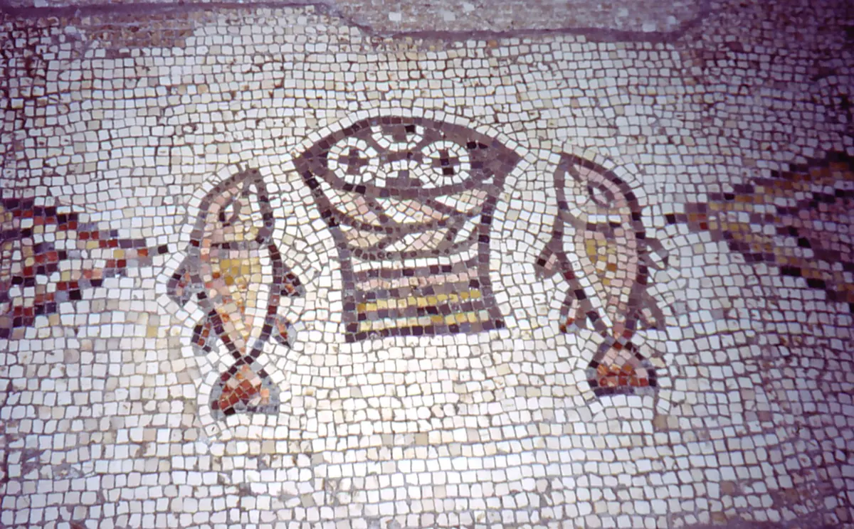 Byzantine mosaic of a basket of bread between two fish