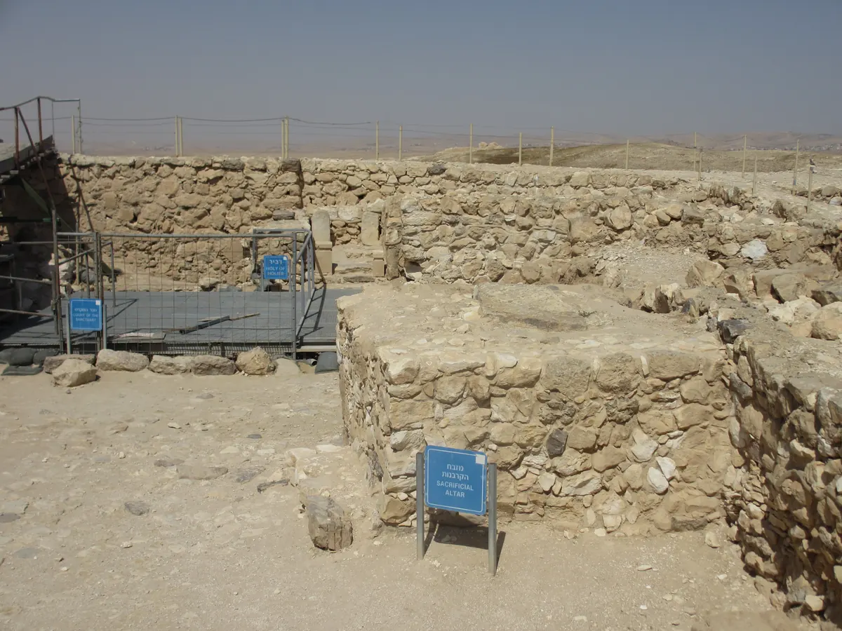 Reconstructed stone temple with a courtyard altar and raised inner room