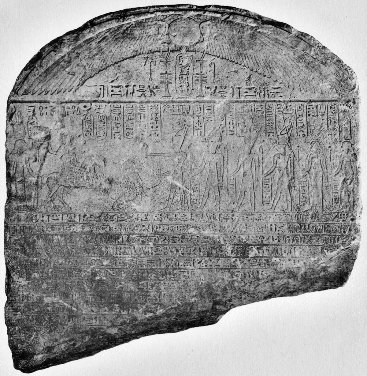 Carved stone stele with hieroglyphic text