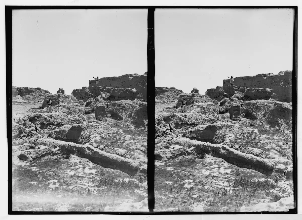 Black-and-white photograph of an excavated mound