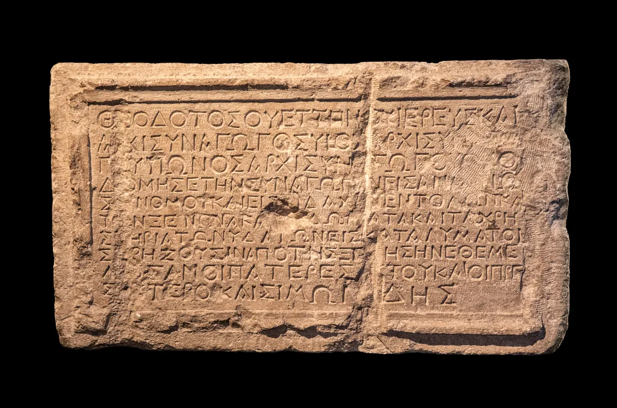 Limestone slab with ten lines of Greek text